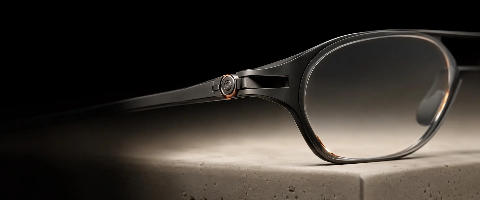 A dark precision eyewear frame detail representing the future KEITZO Lenses direction.